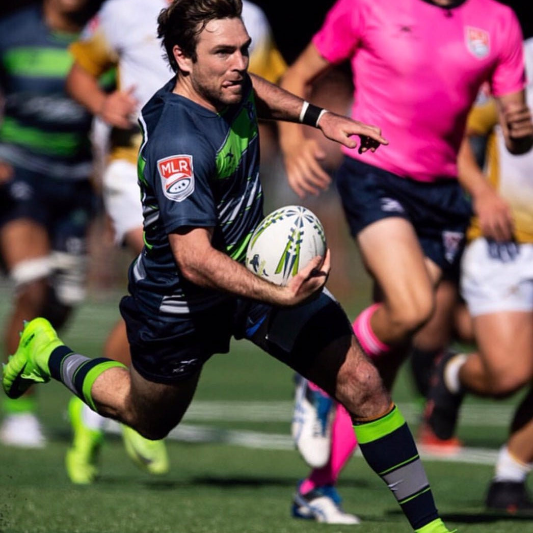 Ram Rugby custom rugby ball bundle showing sizes 5, 4, 3 with logo printing, including match and training balls in bags