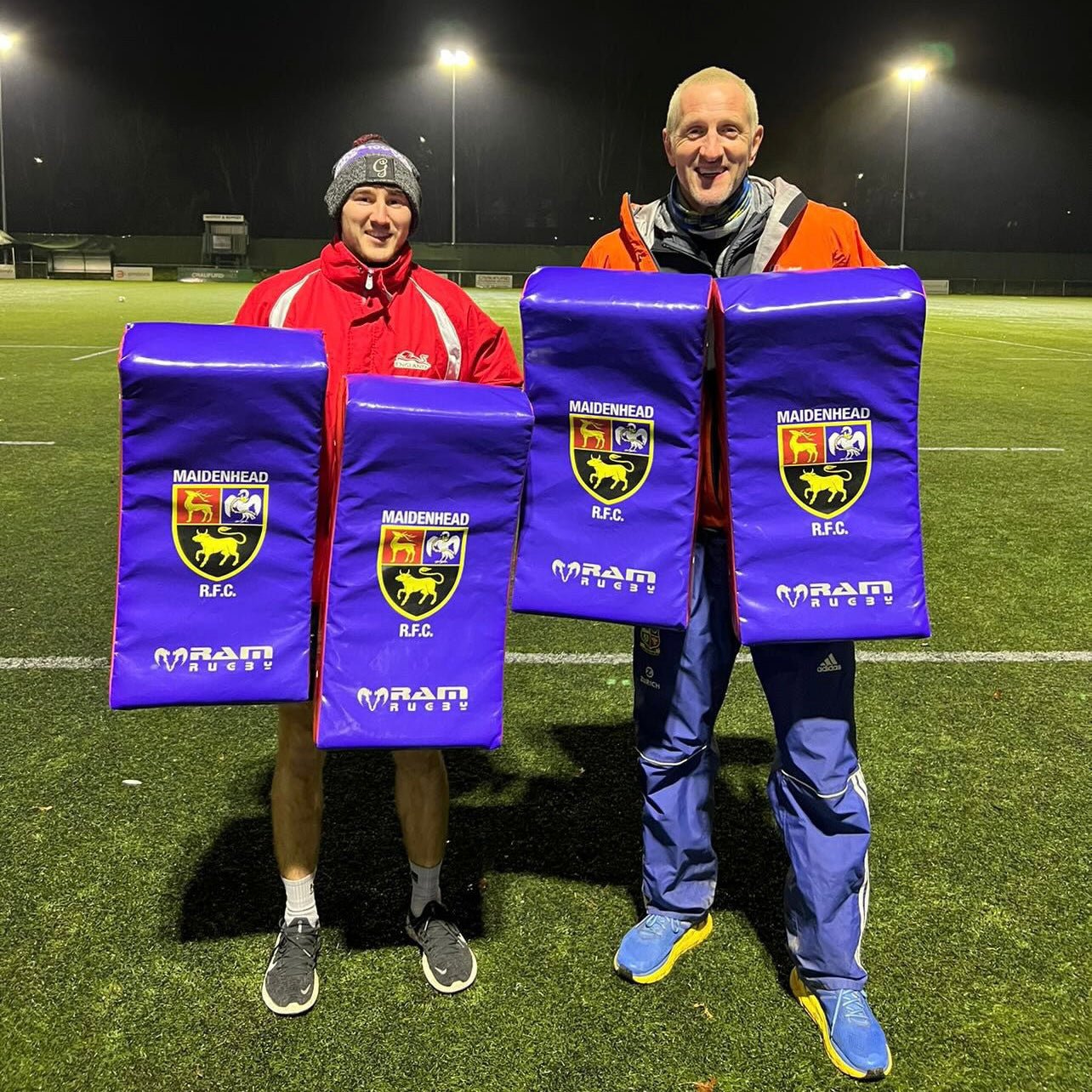 Ram Rugby custom blue and white hit shield with multiple logos, designed for rugby training and impact protection.