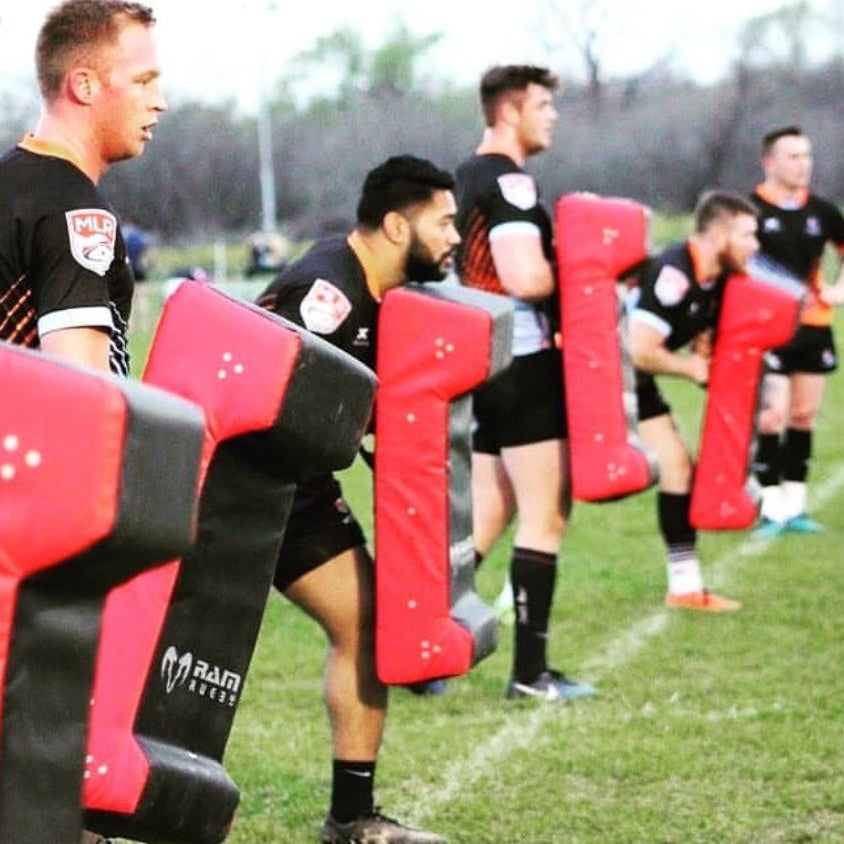 Ram Rugby Double Wedge Hit Shield in black and red with durable PVC and high-density foam for tackle practice impact absorption