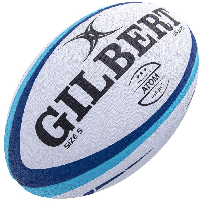 Ten Gilbert Atom size 5 rugby match balls in white, stored inside a black breathable bag designed for easy transport.