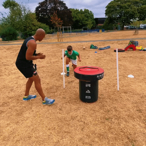 Ram Rugby Weighted Half Tackle Bag in blue heavy-duty vinyl, used for rugby training and tackling drills safety and technique