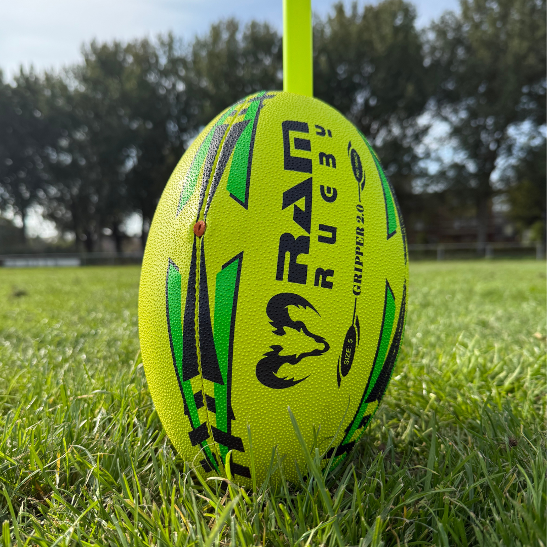 Rugby balls in sizes 3, 4 and 5 lined up for comparison