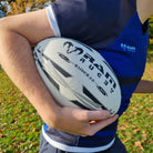 Ram Rugby Raider 2.0 match ball close-up showing durable 4-ply polycotton and rubber laminate for training and game use
