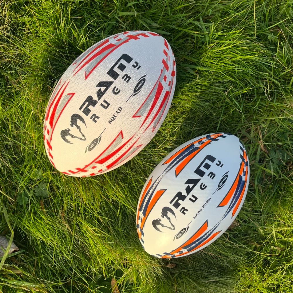Ram Rugby Micro Soft Feel Training Rugby Ball Size 2.5 in white and black, lightweight with a soft padded PVC surface for kids.