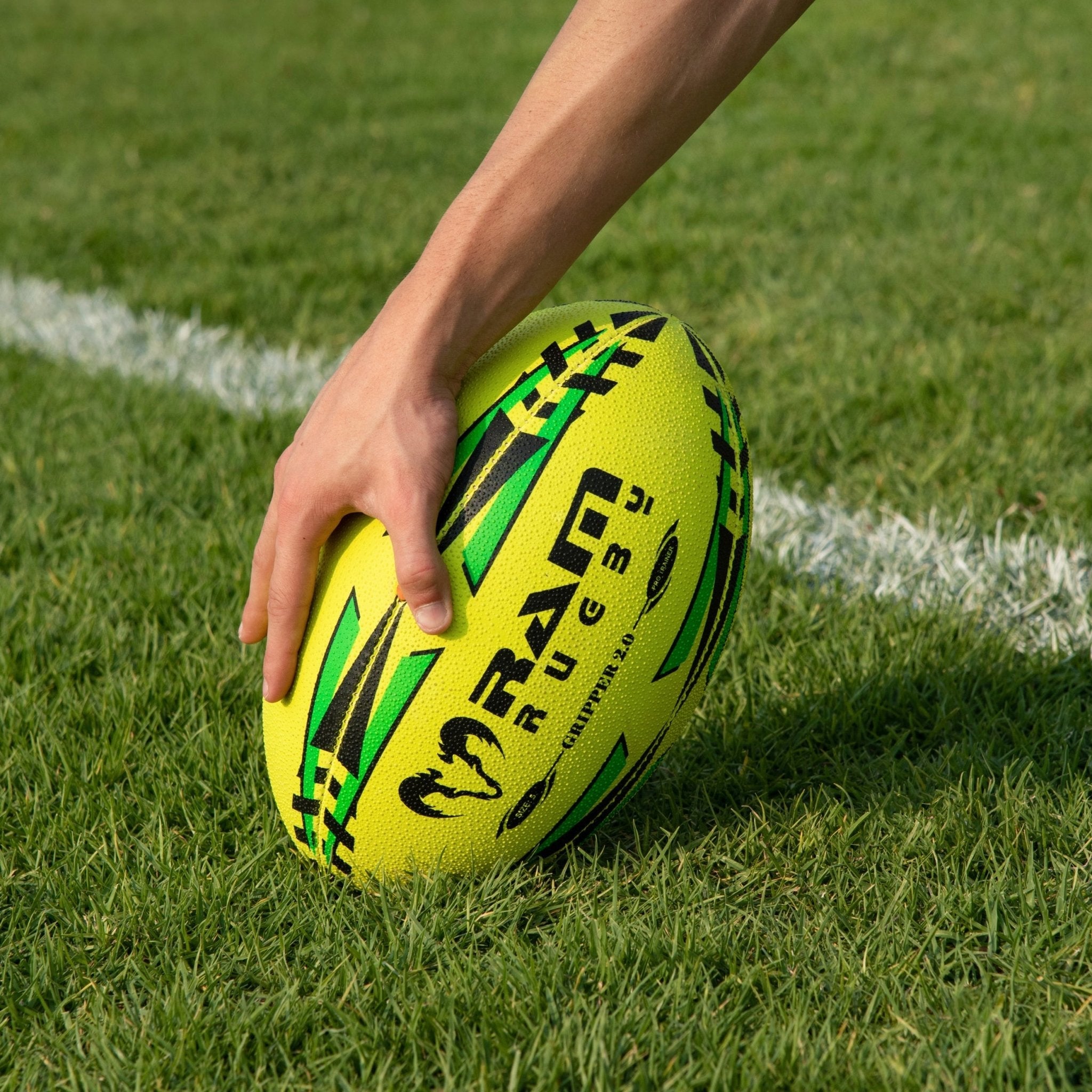 Ram Rugby Gripper 2.0 Neon Pro Trainer Ball for Junior Training shown with 3D grip texture and durable rubber laminate design.