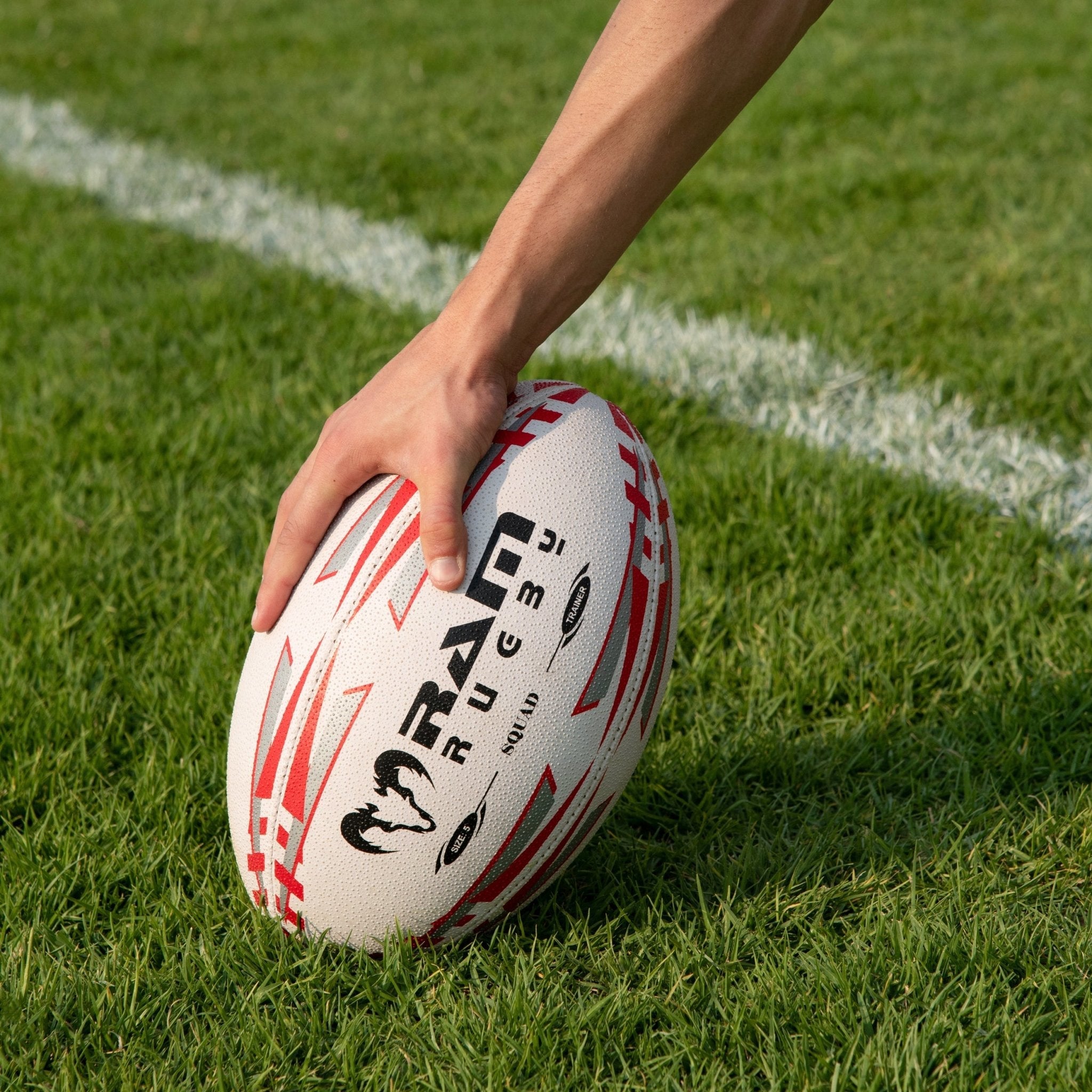 Ram Rugby Squad Trainer Ball Bundle with 30 size 5 rugby balls stacked beside 2 black breathable storage bags for training