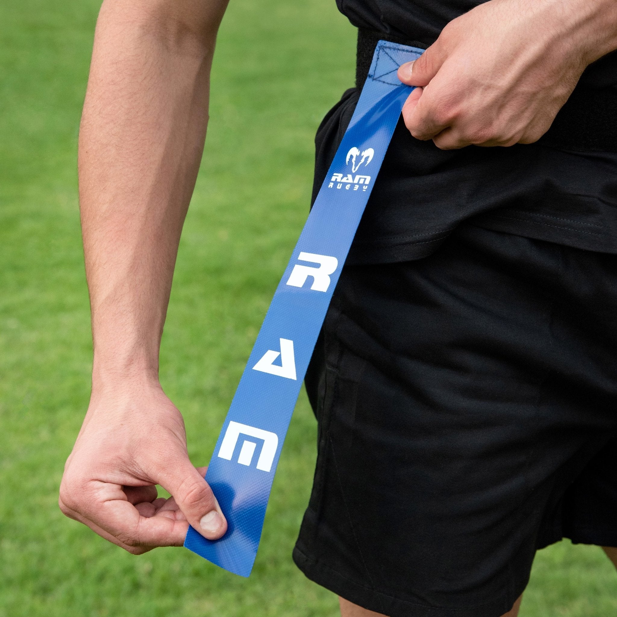Ram Rugby Tag Rugby set featuring 10 adjustable small belts and 20 durable PVC tags in blue and red with storage bag